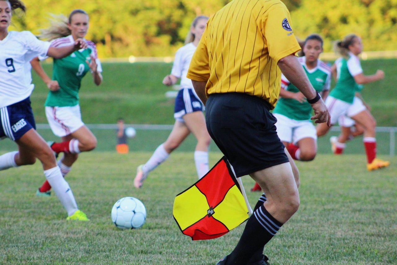 ref and girls soccer game at middle school travel team