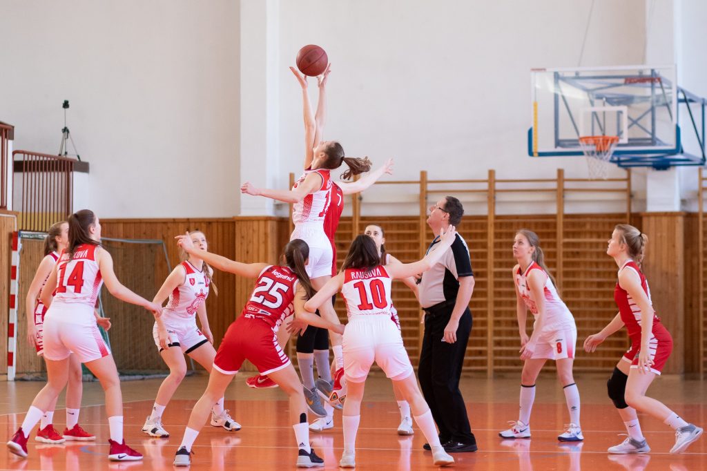 women playing basketball at middle school level ball in air manage your league